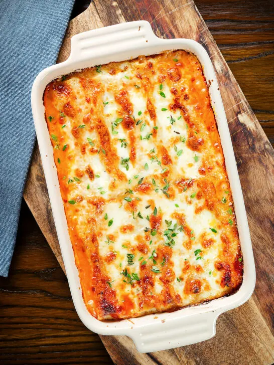 Overhead baked three cheese, pork sausage, leek and ricotta stuffed cannelloni.