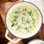 Overhead Cullen skink, Scottish smoked haddock and leek chowder or soup in a pan.