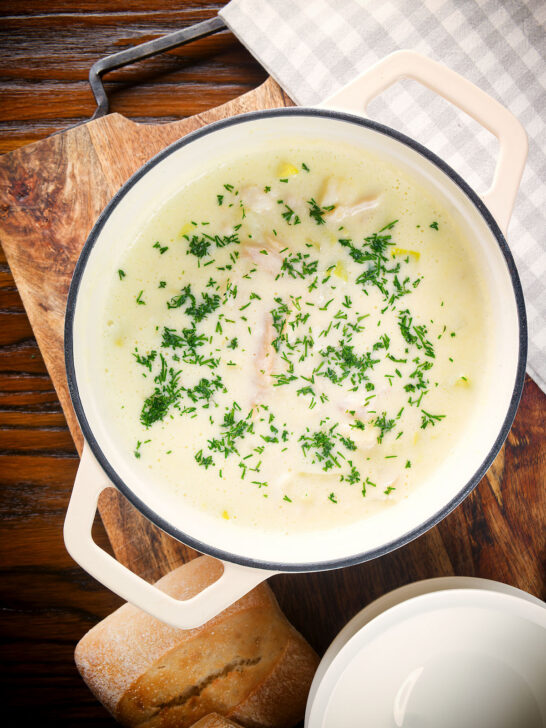 Overhead Cullen skink, Scottish smoked haddock and leek chowder or soup in a pan.