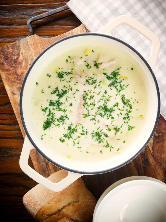 Overhead Cullen skink, Scottish smoked haddock and leek chowder or soup in a pan.