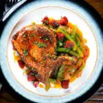 Overhead Spanish influenced pork chops with chorizo served with Basque piperade.