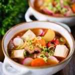 Korean beef doenjang jjigae stew with vegetables and tofu.