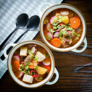 Korean-influenced beef doenjang jjigae with vegetables and tofu.