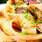 Close-up chicken liver and mushroom pasta with sage, balsamic vinegar and butter.