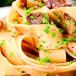 Close-up chicken liver and mushroom pasta with sage, balsamic vinegar and butter.