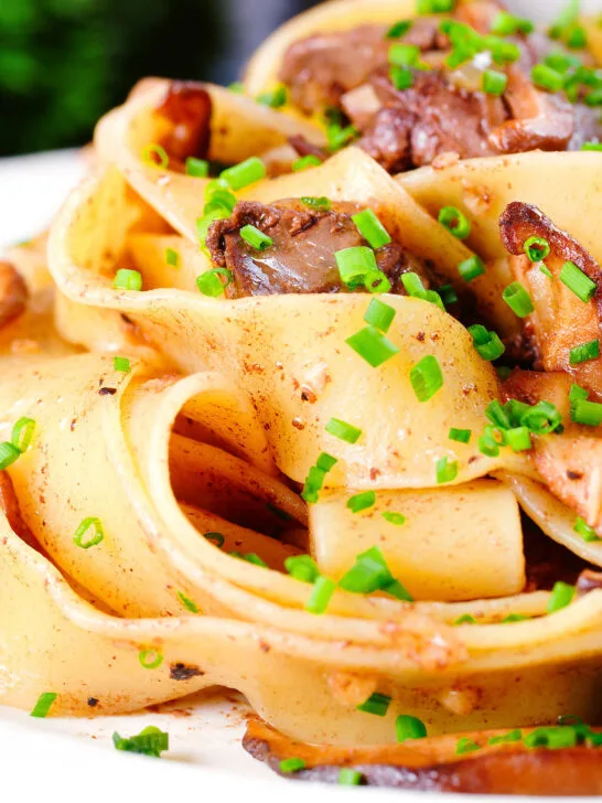 Close-up chicken liver and mushroom pasta with sage, balsamic vinegar and butter.