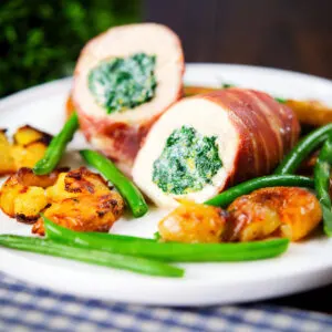 Chicken breast wrapped in Parma ham stuffed with lemony spinach and ricotta served with crushed roasted new potatoes and green beans.