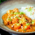 Domoda a West African stew, vegan version with sweet potato and carrot, served with rice.