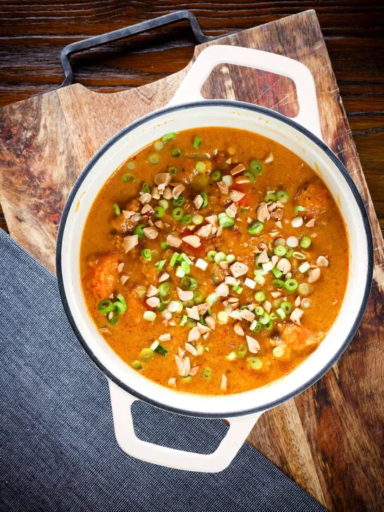 Overhead domoda a West African stew, vegan version with sweet potato and carrot in a pan.