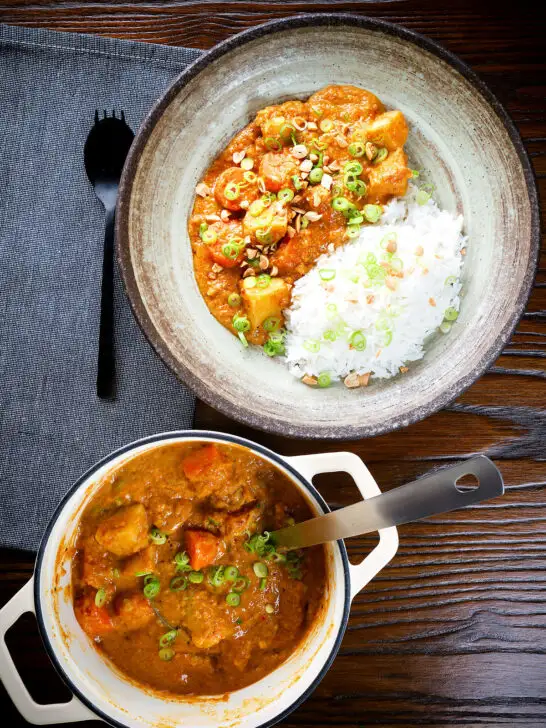 Overhead domoda a West African stew, vegan version with sweet potato and carrot, served with rice.