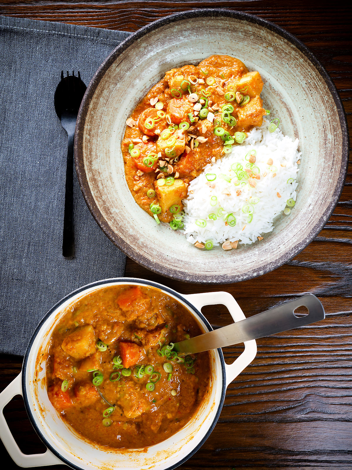 Overhead domoda a West African stew, vegan version with sweet potato and carrot, served with rice.