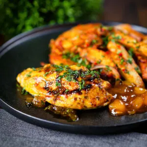 Indian-influenced mango chutney chicken breast served with masala chips.