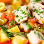 Close-up Marmitako, Basque tuna stew with potatoes, peppers and smoked paprika.