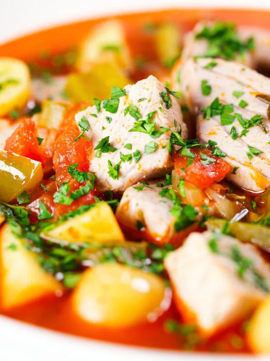 Close-up Marmitako, Basque tuna stew with potatoes, peppers and smoked paprika.