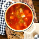 Marmitako, Basque tuna stew with potatoes, peppers and smoked paprika in its cooking pot.