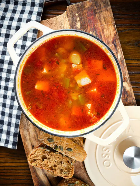 Marmitako, Basque tuna stew with potatoes, peppers and smoked paprika in its cooking pot.