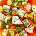 Close-up overhead Marmitako, Basque tuna stew with potatoes, peppers and smoked paprika.