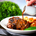 Spanish-influenced braised oxtail (rabo de toro) with roast potatoes and green beans.