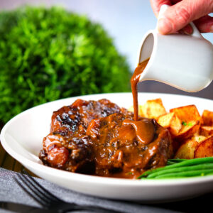 Spanish-influenced braised oxtail (rabo de toro) with roast potatoes and green beans.