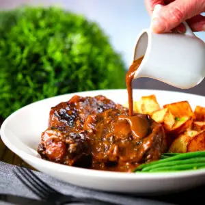 Spanish-influenced braised oxtail (rabo de toro) with roast potatoes and green beans.
