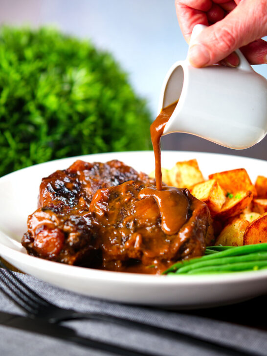 "Gravy" poured over Spanish-influenced braised oxtail (rabo de toro) served with green beans and potatoes.