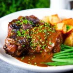 Spanish-influenced braised oxtail (rabo de toro) with mini roast potatoes and green beans.