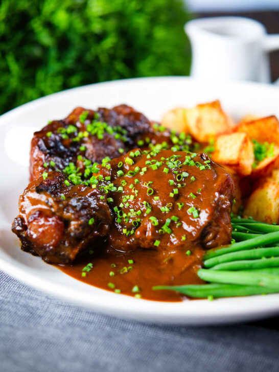 Spanish-influenced braised oxtail (rabo de toro) with mini roast potatoes and green beans.