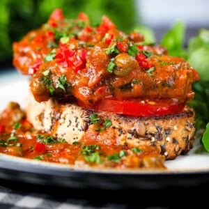 Tinned sardines on toast with capers, fresh tomato and chilli served with watercress.