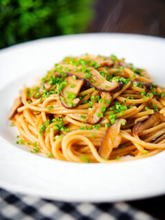 Vegetarian miso mushroom pasta (spaghetti) with snipped chives.