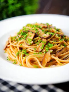Vegetarian miso mushroom pasta (spaghetti) with snipped chives.