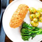 Ovcerhead air fryer chicken cordon bleu with buttered potatoes and broccoli.