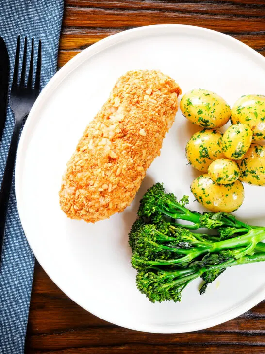Ovcerhead air fryer chicken cordon bleu with buttered potatoes and broccoli.