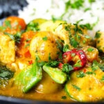 Close-up sayur kare, a Balinese vegetable and tofu curry served with Jasmine rice and fresh coriander.