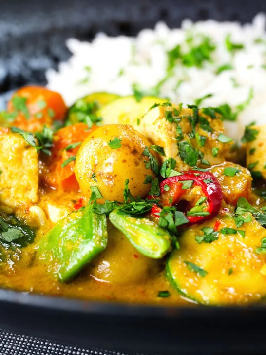 Close-up sayur kare, a Balinese vegetable and tofu curry served with Jasmine rice and fresh coriander.
