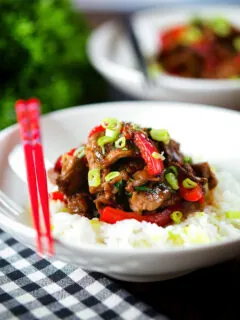 Spicy Thai basil and beef stir fry served with jasmine rice and spring onions.