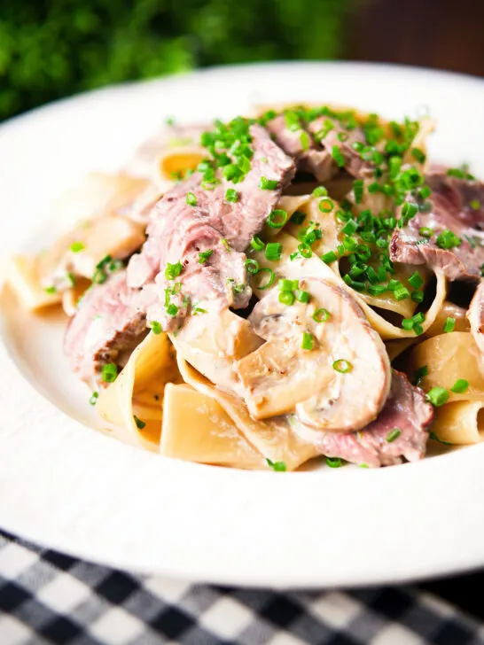 Creamy steak and mushroom pasta (pappardelle) with a "Diane" sauce and snipped chives.