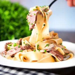 Creamy steak and mushroom pasta with a "Diane" sauce and snipped chives.