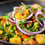 Close-up minced beef, potato and pea curry (aloo keema matar).