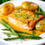 Pan fried halibut with Thai yellow curry sauce, potatoes, green beans and coriander.