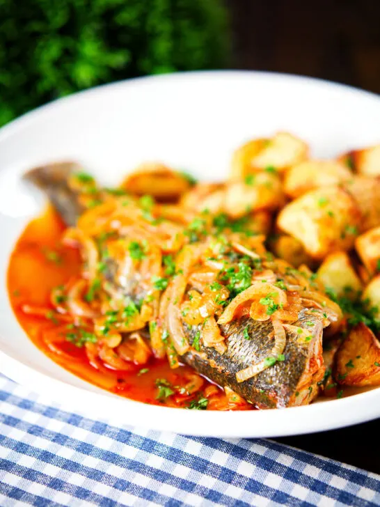 Bourdeto, whole sea bass stew in a paprika broth with crispy potatoes.