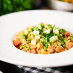 Chicken and chorizo risotto with peas, Manchego cheese and fresh parsley.