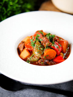 Filipino beef kaldereta (caldereta) stew garnished with coriander.