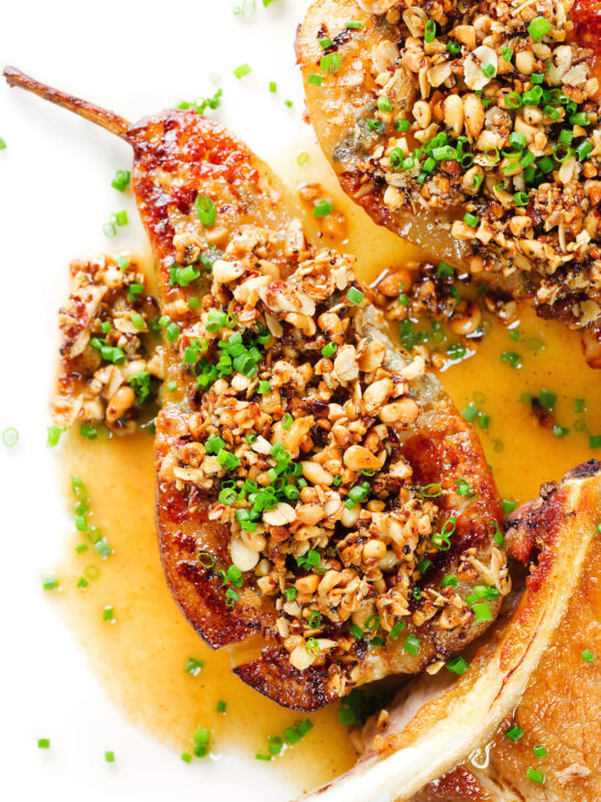 Close-up overhead blue cheese roasted pears with a nutty crumble and cider sauce.