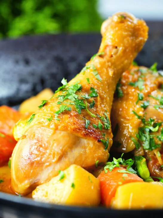 Close-up Vietnamese yellow chicken curry (ca ri ga) served with jasmine rice.