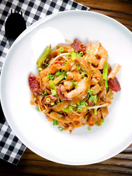 Overhead char kway teow (flat rice noodle stir fry) with Chinese sausage and prawns.