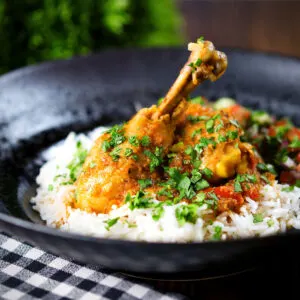 Homestyle Pakistani chicken salan curry with basmati rice and kachumber salad.