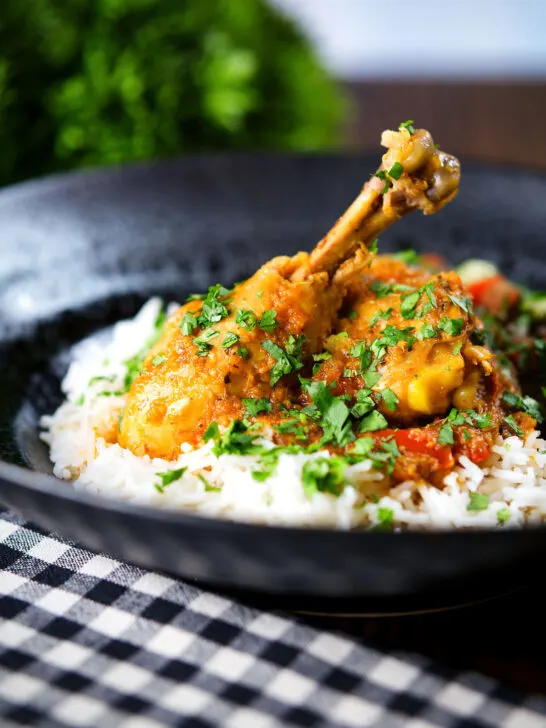Pakistani chicken salan curry with plain rice and kachumber salad.