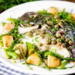 Whole roast turbot with capers, new potatoes, samphire, asparagus, sugar snap peas and garden peas.