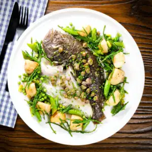 Whole roast turbot (on the bone) with capers, new potatoes, samphire, asparagus and peas.