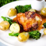 Baked apple and bacon stuffed pork chops, with cider gravy, potatoes and broccoli.